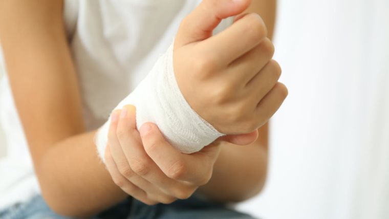 Child with a bandaged wrist